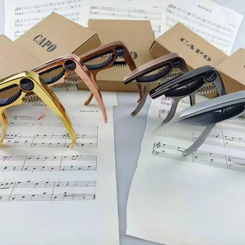 Musical Instrument Ending In A - Gitaar capo van metaal, voor elektrische