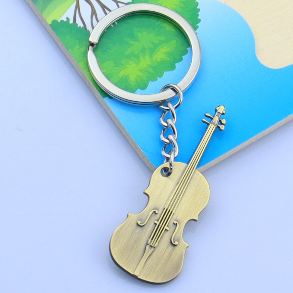Coole metalen gitaar sleutelha - Musical Instruments Cartoon recensie en prijs